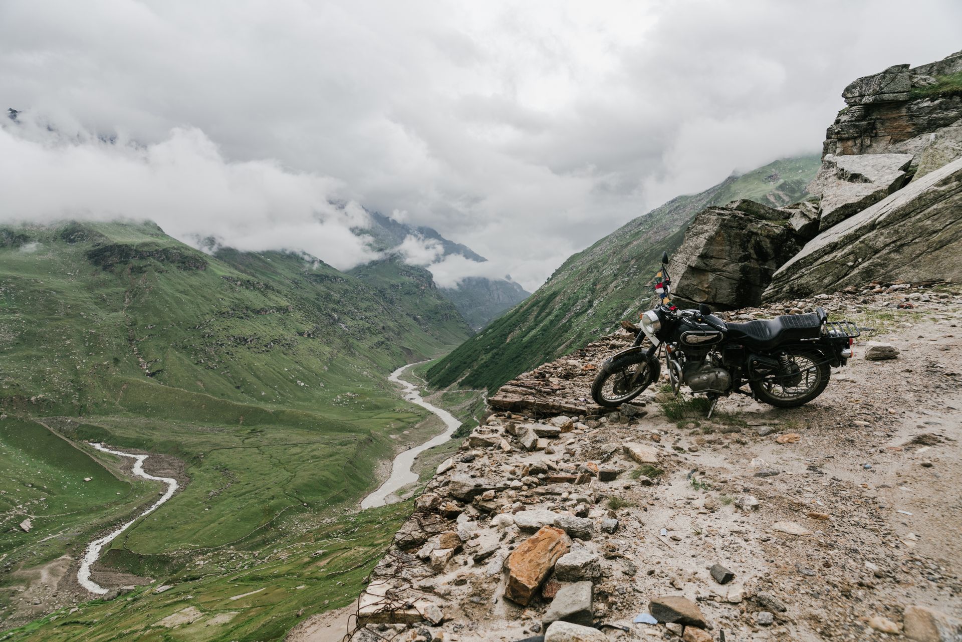 Motorcycle beside a remote mountain road